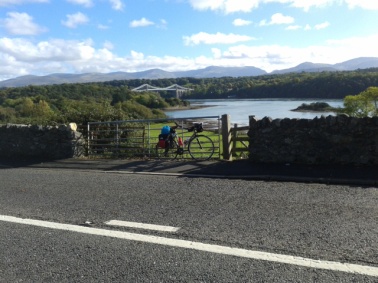 On sunny Anglesey, looking back across Menai Bridge towards Snowdonia